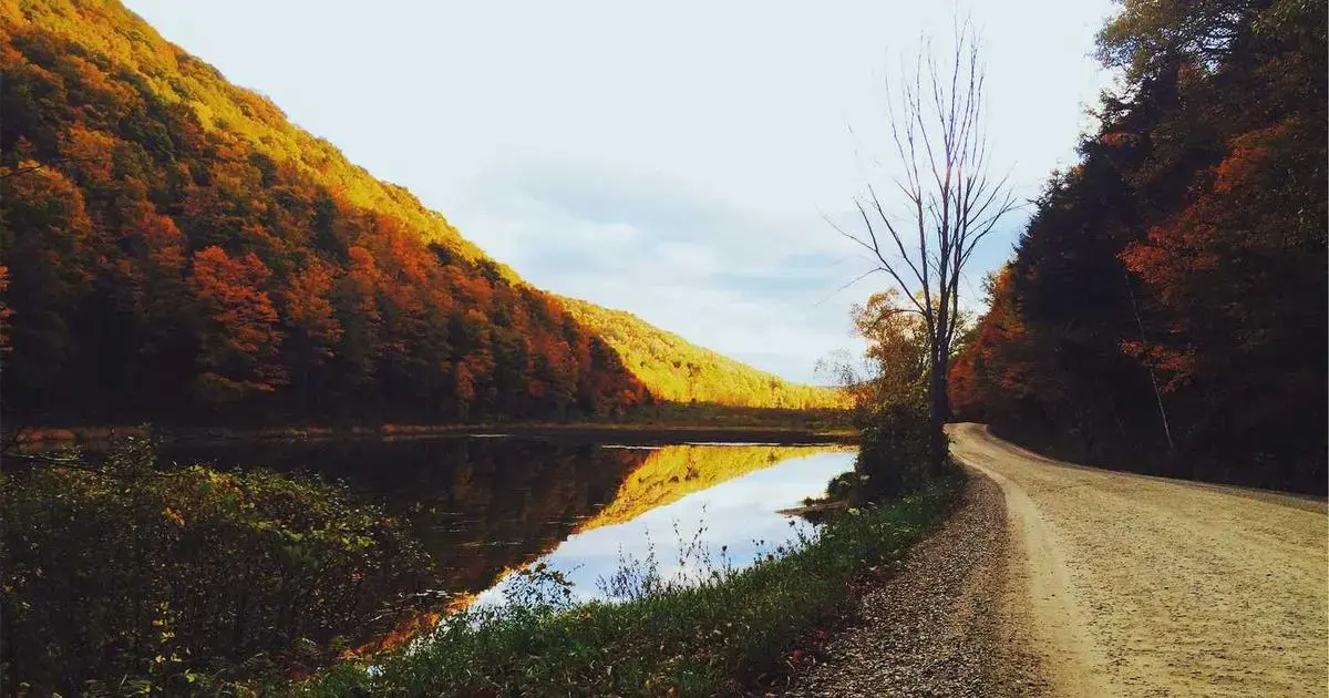 student receiving I-20 form from school official